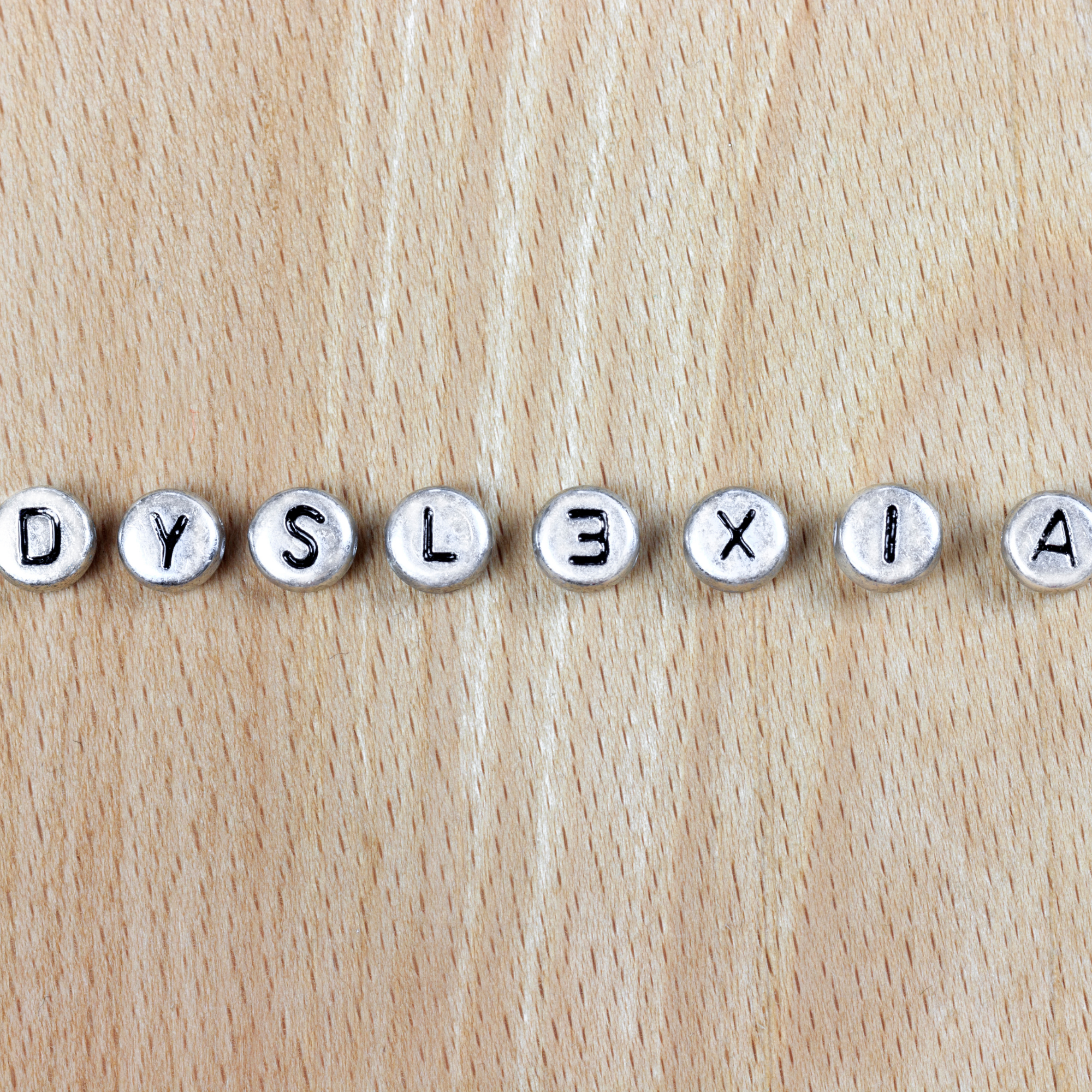 Older woman and young girl reading together in a warm community setting